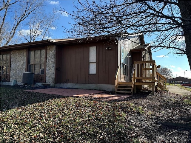 view of home's exterior featuring central AC and a patio area