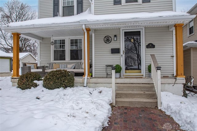 view of snow covered property entrance