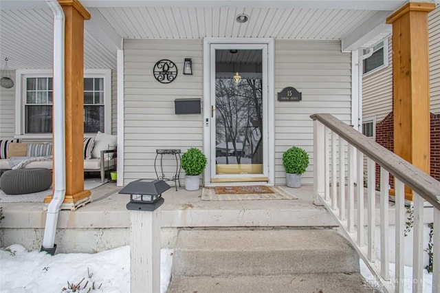 entrance to property featuring a porch