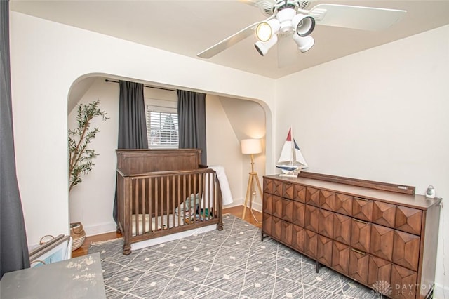 bedroom featuring wood-type flooring and ceiling fan