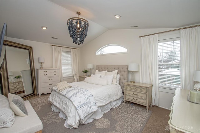 bedroom with lofted ceiling, light colored carpet, and an inviting chandelier