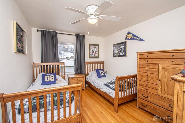 bedroom featuring ceiling fan and light hardwood / wood-style flooring