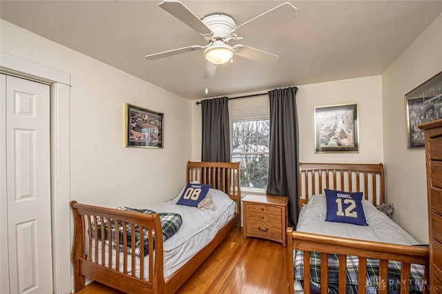 bedroom with hardwood / wood-style flooring and ceiling fan