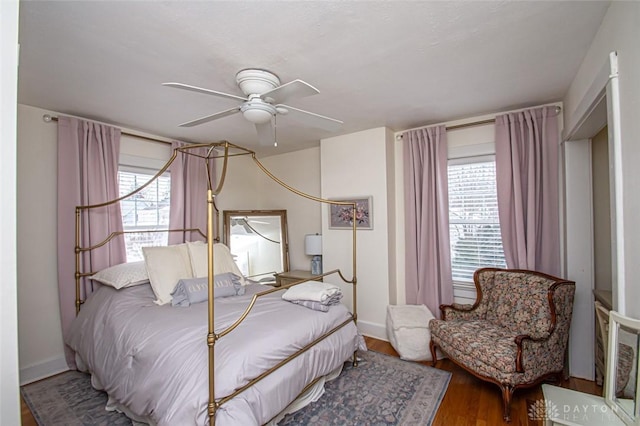 bedroom featuring wood-type flooring and ceiling fan