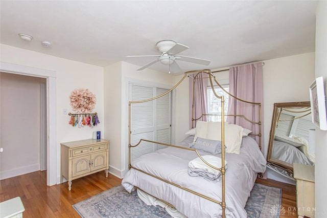 bedroom with light hardwood / wood-style floors, a closet, and ceiling fan