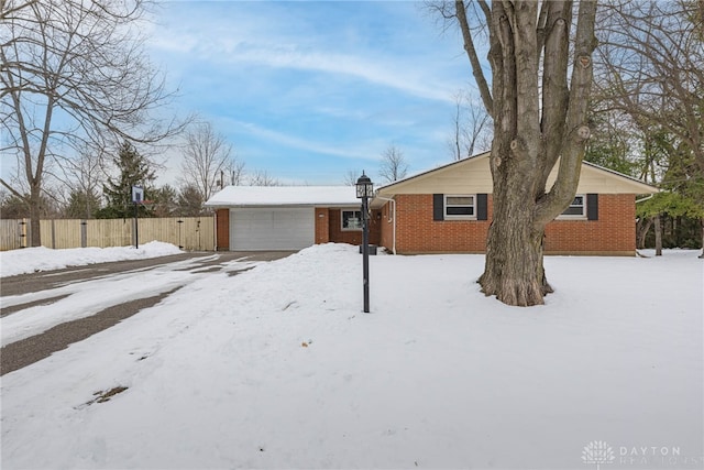 single story home with a garage