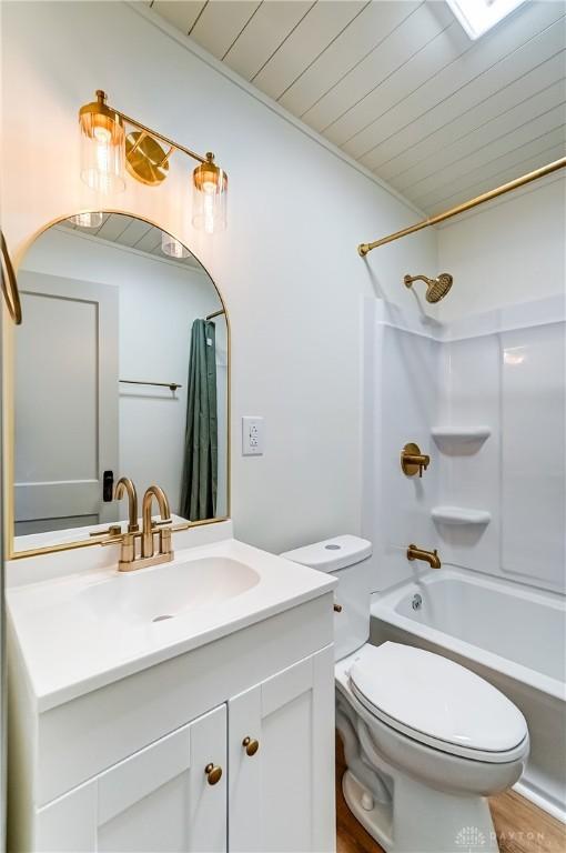 full bathroom with shower / bath combination with curtain, wooden ceiling, toilet, vanity, and hardwood / wood-style flooring