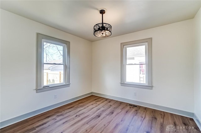 empty room with light wood-type flooring