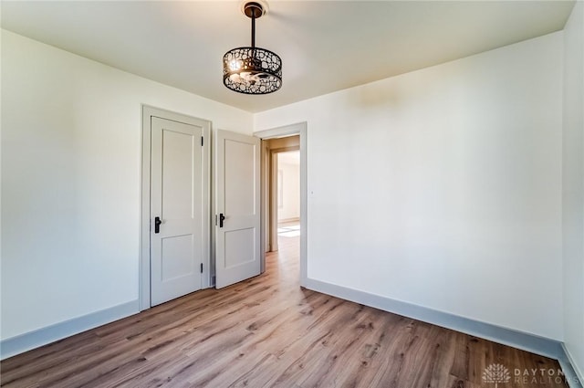 unfurnished room featuring light hardwood / wood-style floors