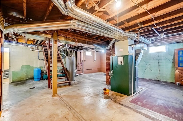 basement with water heater and heating unit