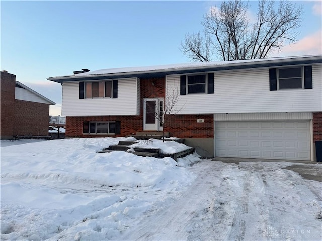 split foyer home featuring a garage