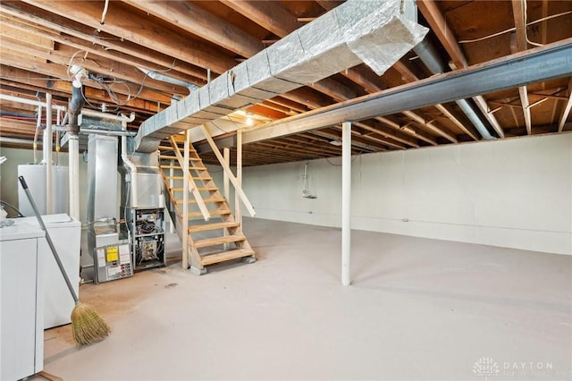 unfinished basement with water heater and stairs