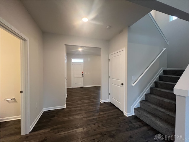 hallway featuring dark hardwood / wood-style flooring