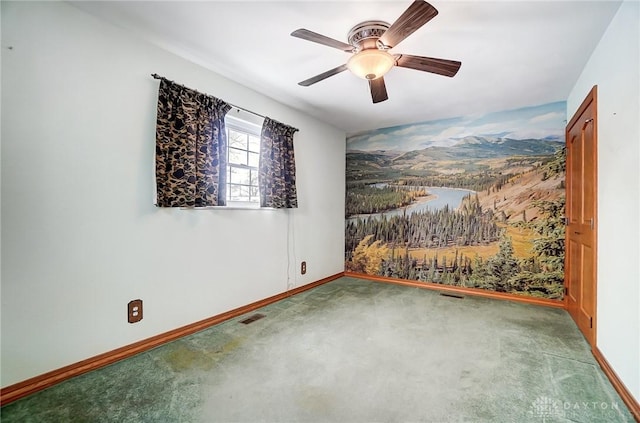 carpeted empty room featuring ceiling fan