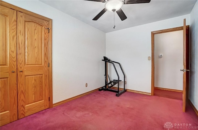 workout area featuring ceiling fan and carpet