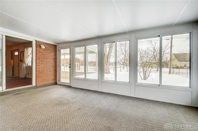 unfurnished sunroom with a wealth of natural light