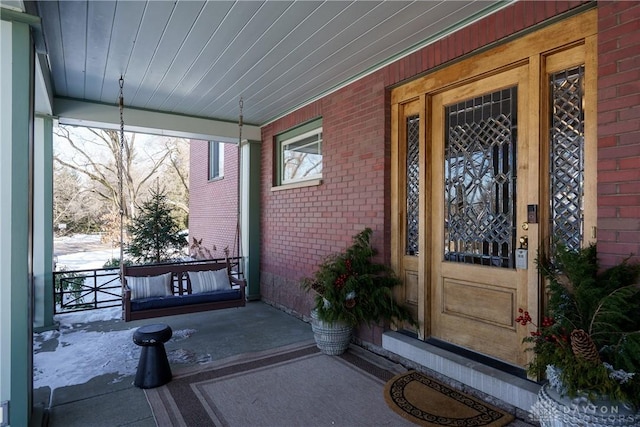 doorway to property with a porch