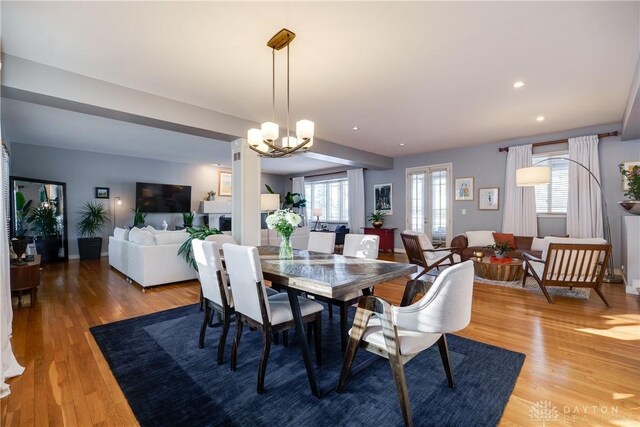 dining space featuring an inviting chandelier and wood-type flooring