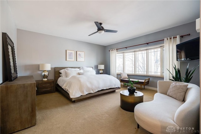 bedroom featuring ceiling fan and light carpet