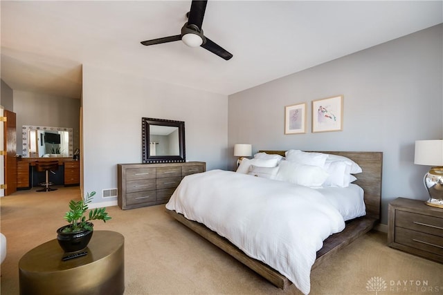 carpeted bedroom featuring ceiling fan