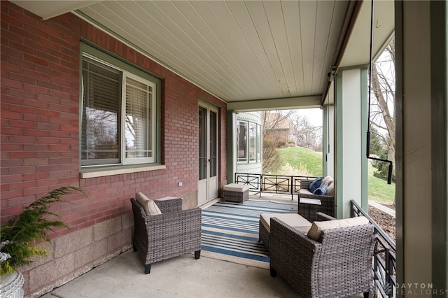 sunroom / solarium featuring wooden ceiling