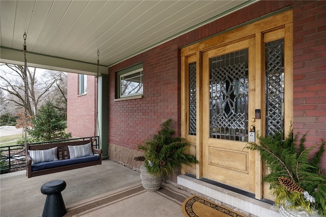 doorway to property featuring covered porch