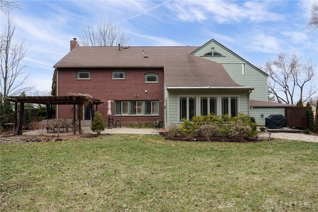 back of property featuring a lawn, a patio area, and a pergola