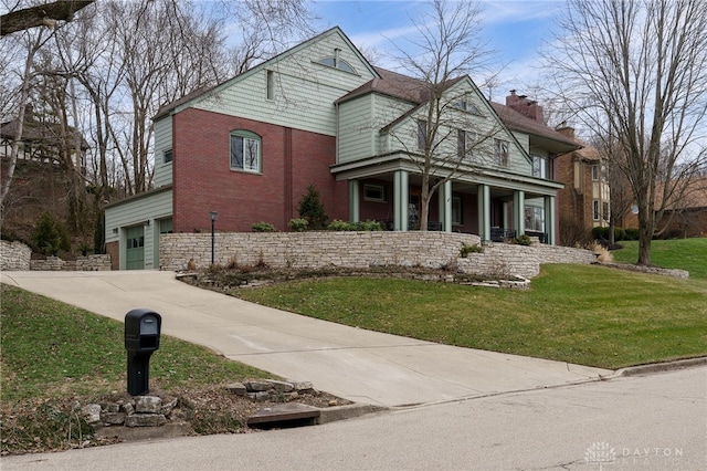 view of front property with a garage and a front lawn