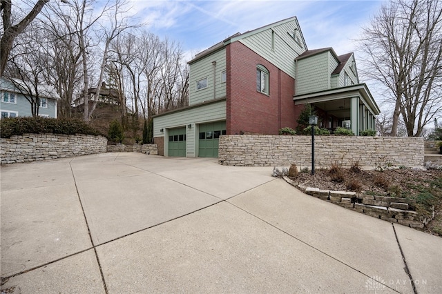 view of side of home with a garage