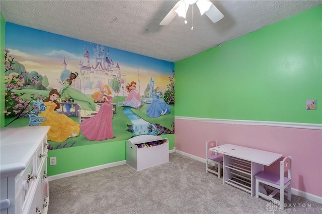 carpeted bedroom featuring a textured ceiling and ceiling fan