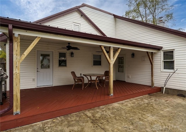 rear view of house featuring a deck and ceiling fan