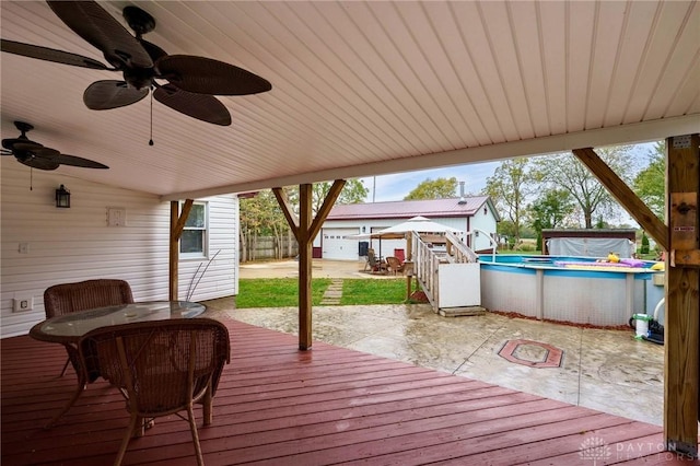 wooden terrace with a patio and ceiling fan