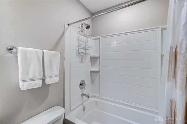 bathroom with toilet and shower / tub combo with curtain