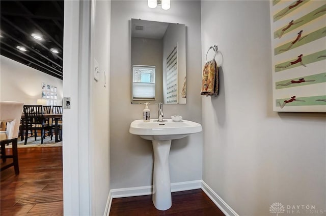 bathroom with wood-type flooring