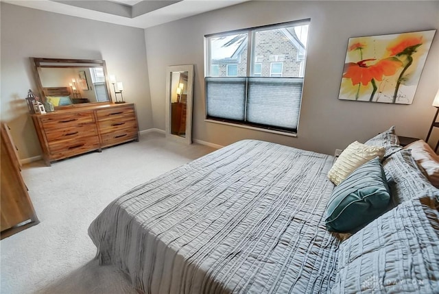 bedroom with light colored carpet