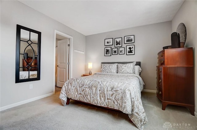 bedroom with light colored carpet