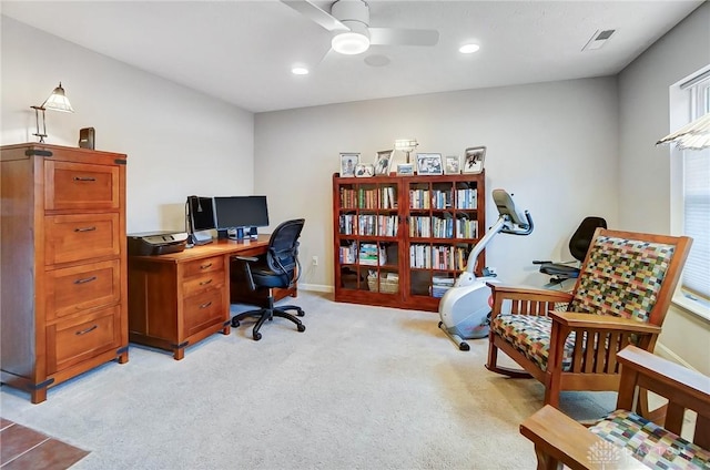 office featuring ceiling fan and light carpet