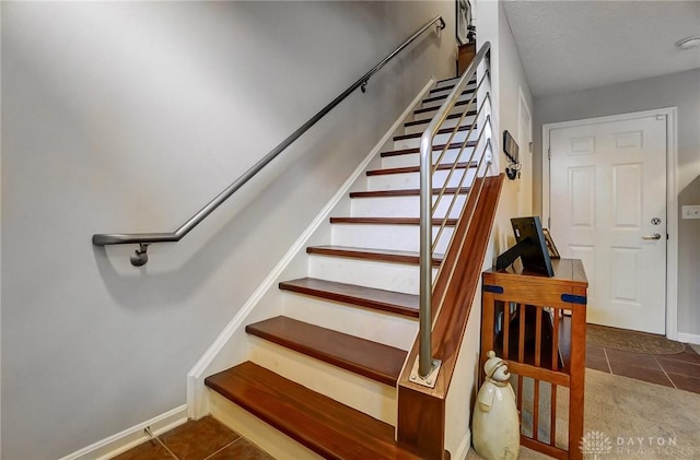 stairs with tile patterned floors