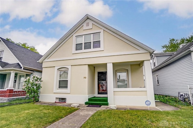 view of front of property with a front lawn