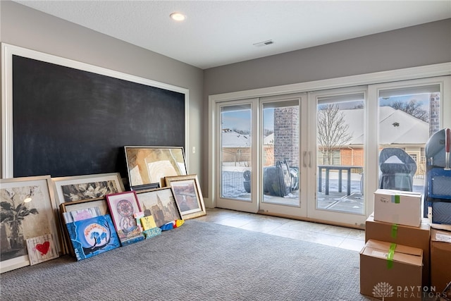 entryway with light carpet