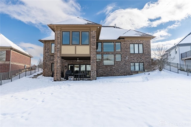 view of snow covered house