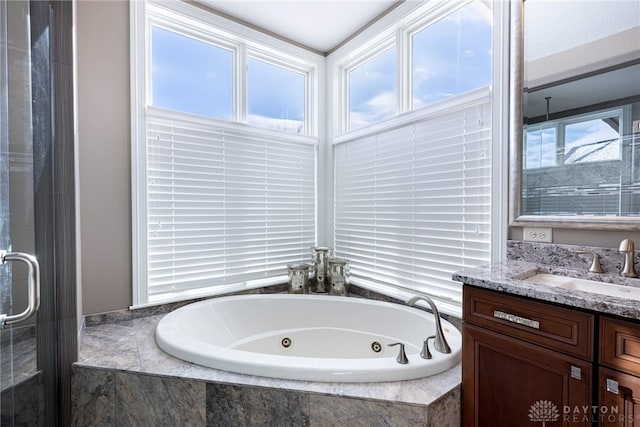 bathroom featuring separate shower and tub and vanity