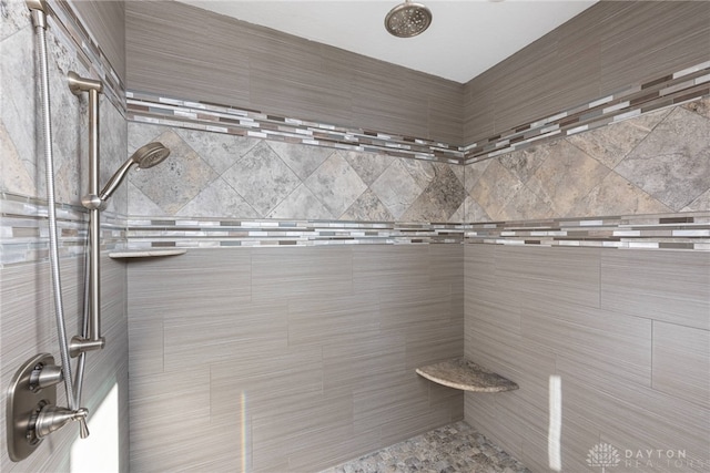 bathroom with tiled shower