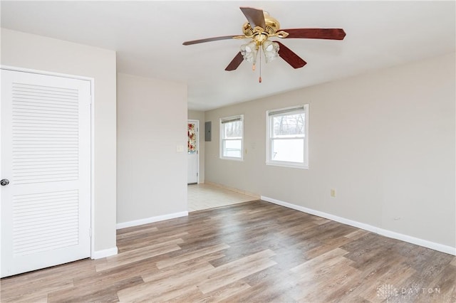 unfurnished room featuring ceiling fan and light hardwood / wood-style floors