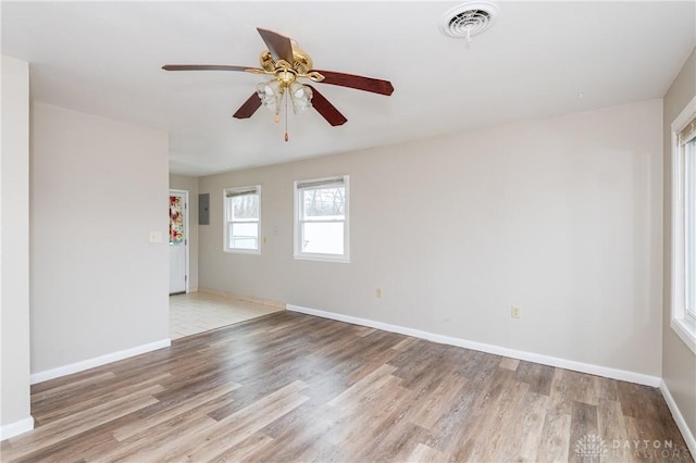 empty room with ceiling fan and light wood-type flooring