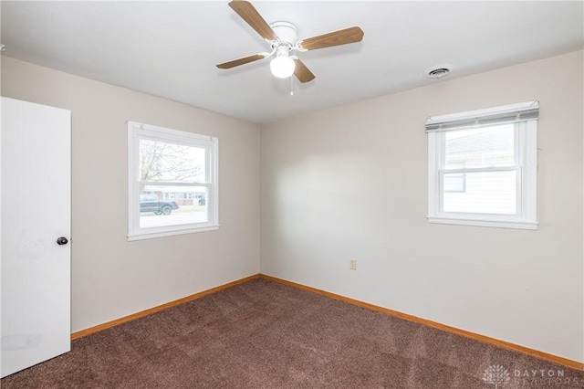 unfurnished room with carpet floors and ceiling fan