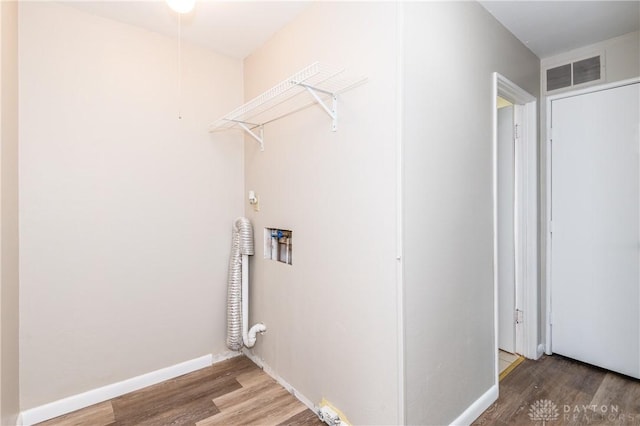 laundry area with washer hookup and hardwood / wood-style floors