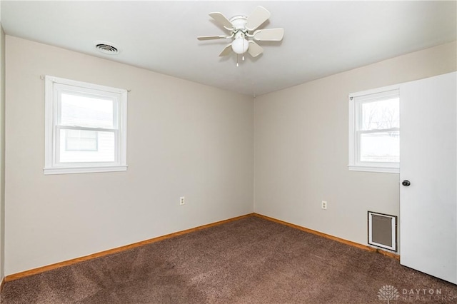 spare room featuring ceiling fan and carpet floors