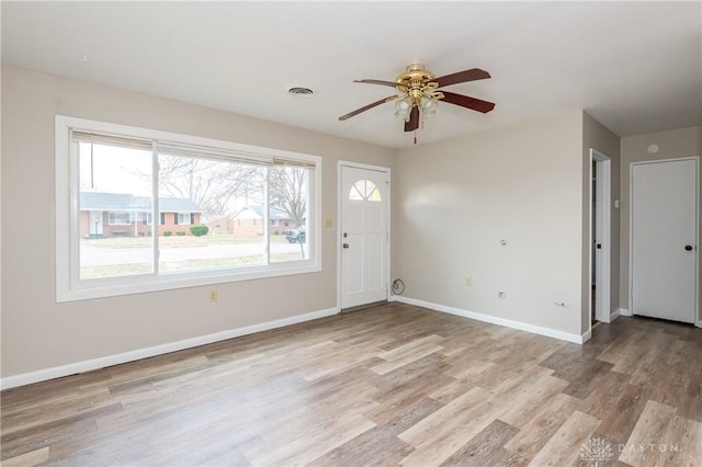 foyer with ceiling fan and light hardwood / wood-style flooring