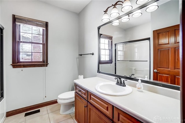 full bathroom featuring enclosed tub / shower combo, vanity, toilet, and tile patterned flooring